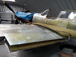 All the paint removed reveals the superb condition of the Curtiss P-40.